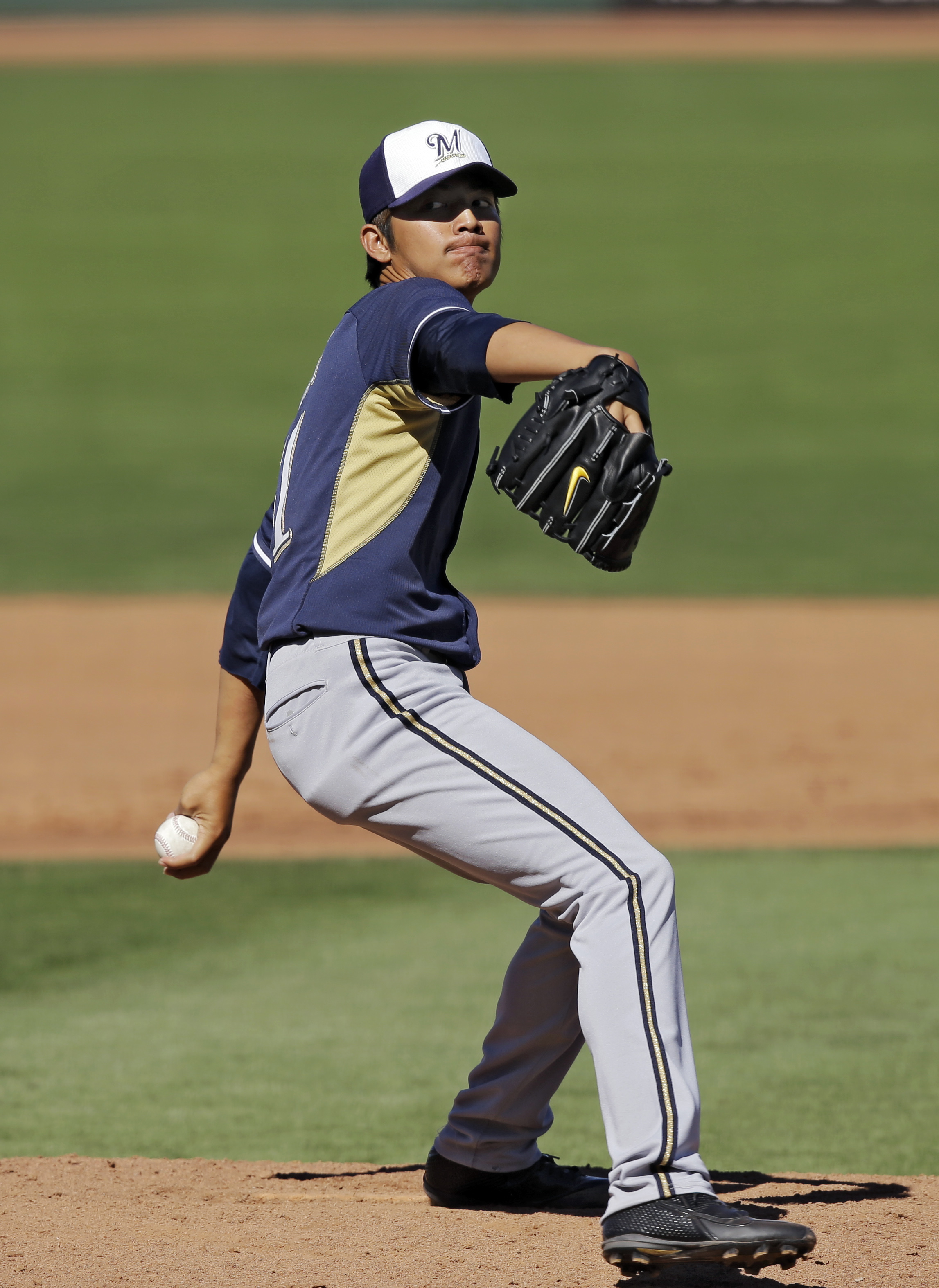 Tomlin pitches Indians past Brewers 4-2