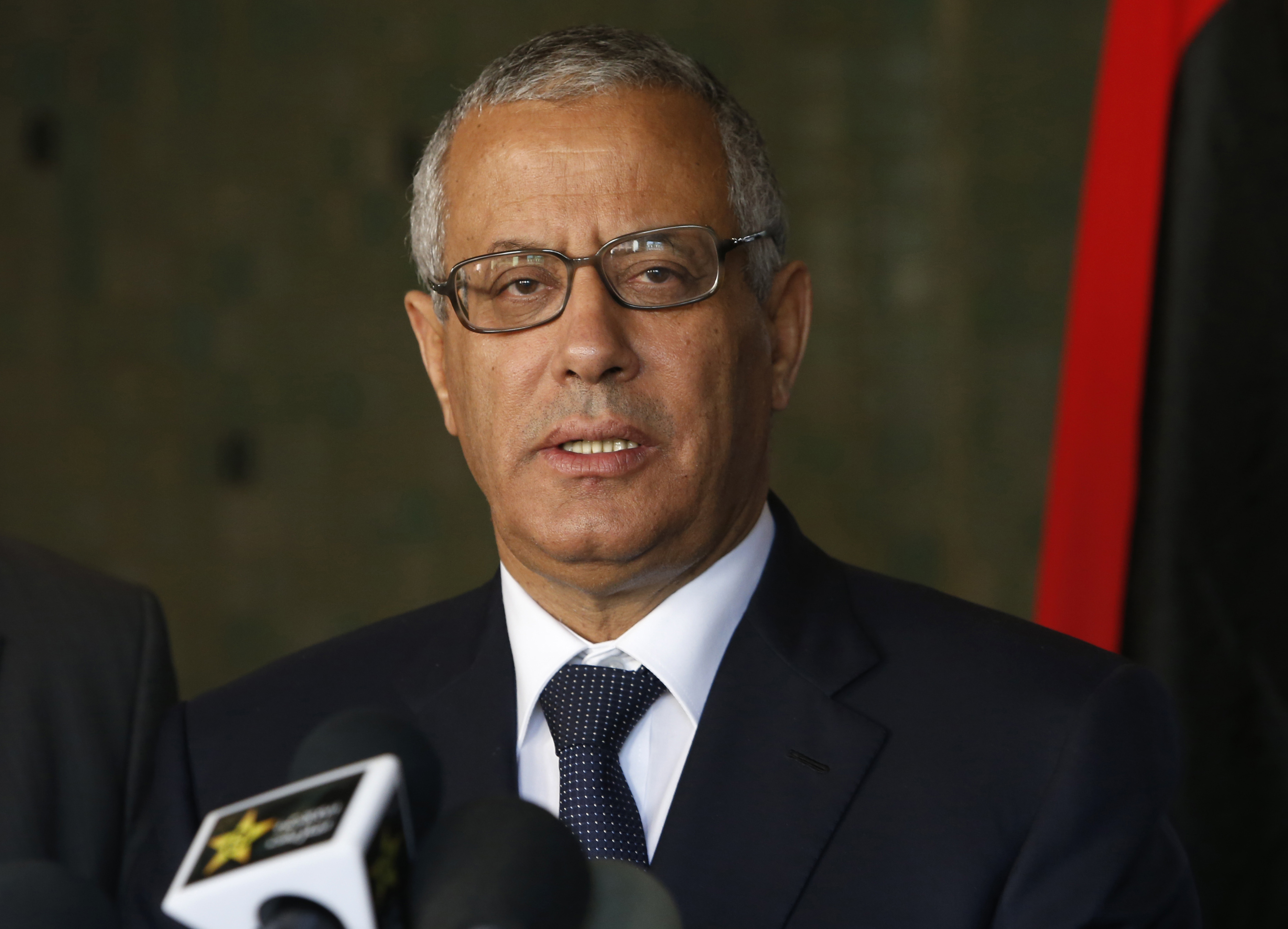 Libya's ousted PM leaves country despite ban