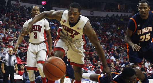 Jamal Aytes (14) goes for a loose ball during a game against
Tennessee-Martin. Aytes will be counted on to help replace Eric Mika's
production.