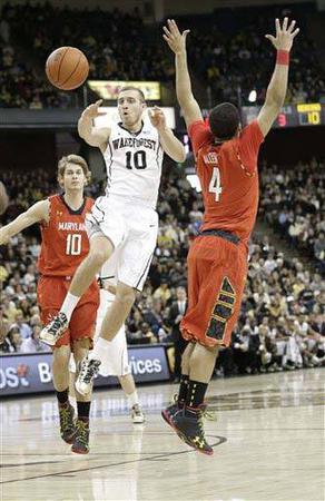 Wake Forest's Chase Fischer (10) passes the ball against Maryland. 
Fischer will add to a talented backcourt in 2014.