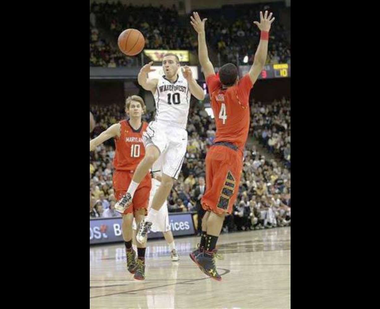 Wake Forest's Chase Fischer (10) passes the ball against Maryland.
Fischer will add to a talented backcourt in 2014.