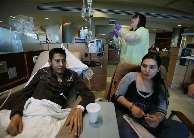 Margarito Morales sits with his wife, Lupe
Corona, as he receives his medication by IV
March 28, 2014, at the Huntsman Cancer
Institute in Salt Lake City. (Photo: Scott G
Winterton, Deseret News)