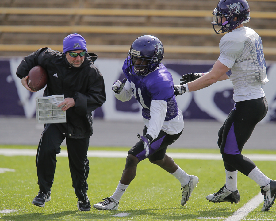 Weber State offensive coordinator Steve Clark participates during
spring practice at Stewart Stadium in Ogden.