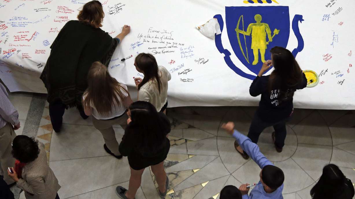 Governor signs huge Boston Marathon prayer canvas