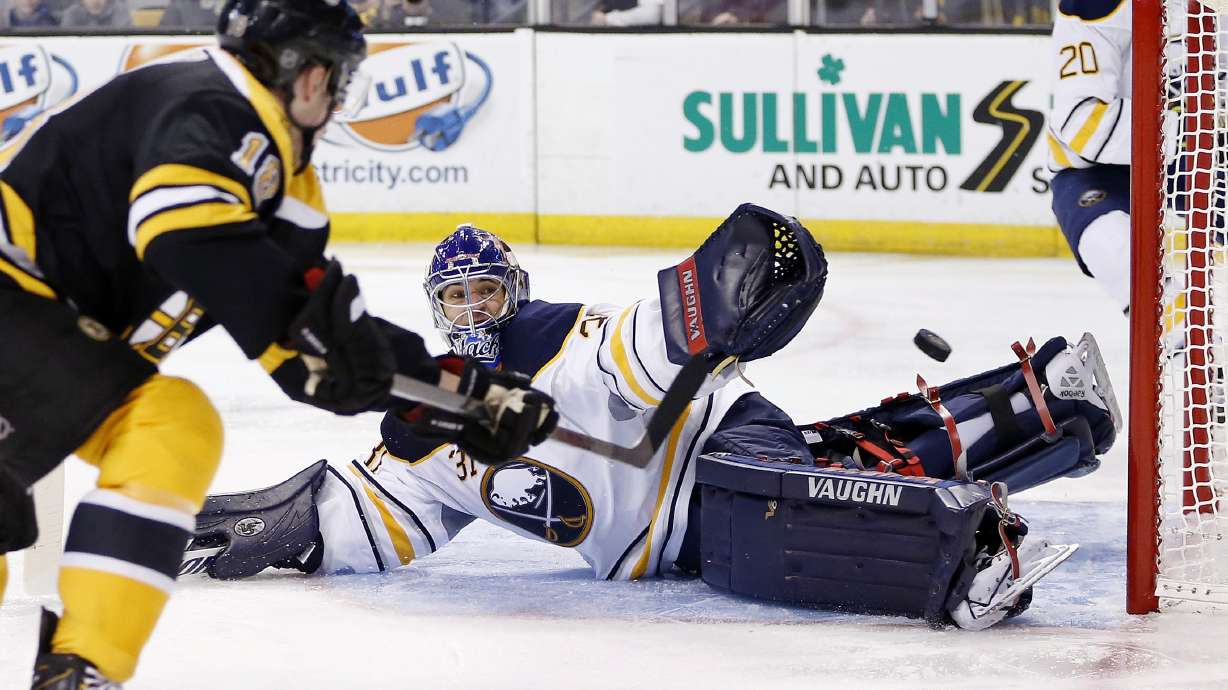 Bruins clinch NHL's top record, beat Sabres 4-1