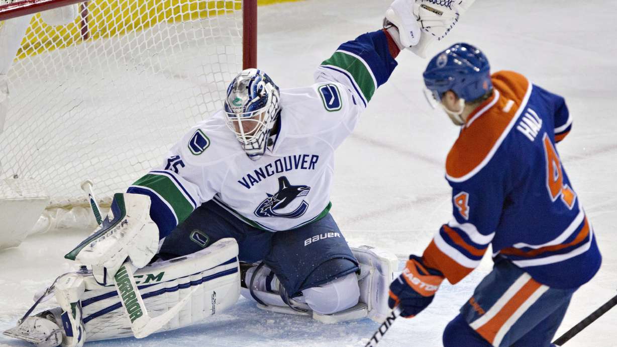Hall has 3 assists in Oilers' 5-2 win over Canucks