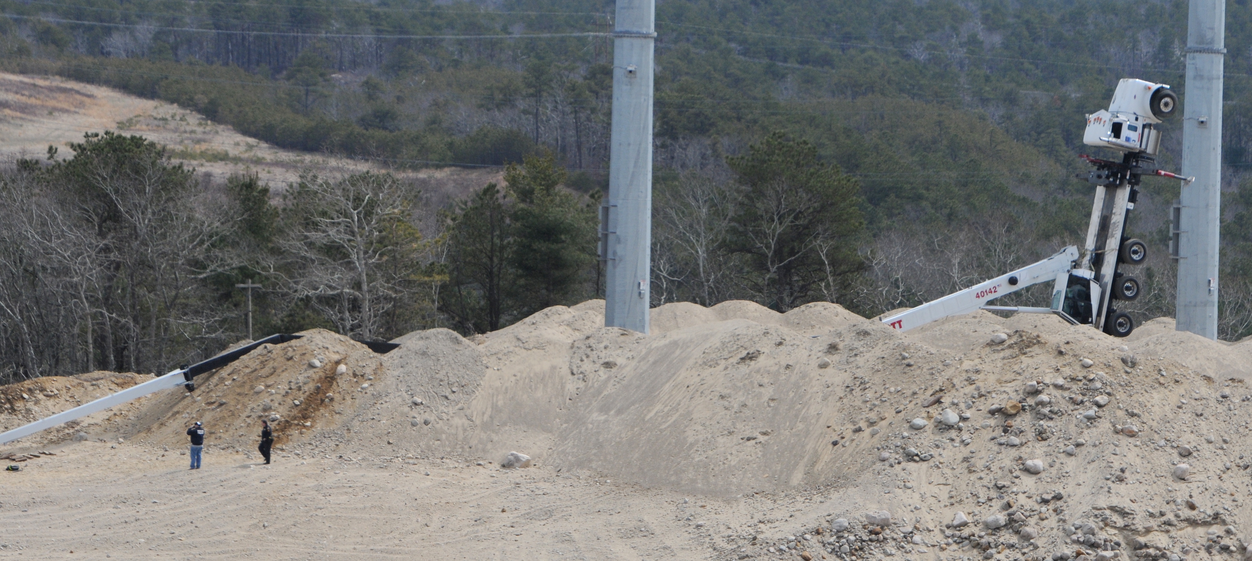 Officials identify 2 killed when truck topples