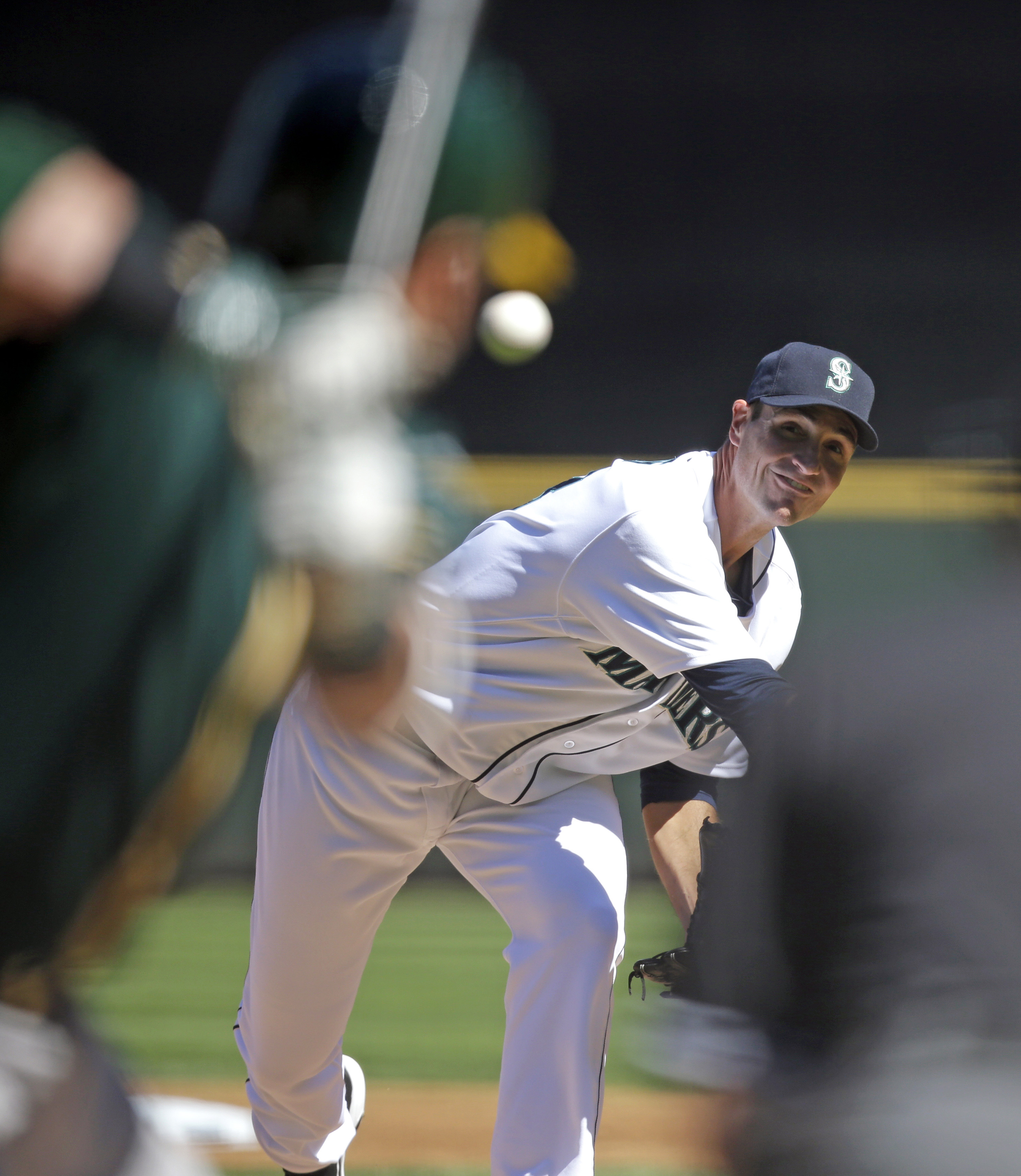 Young throws 6 scoreless innings, A's top Mariners