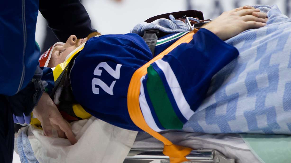 Canucks' Daniel Sedin injured by hit from behind