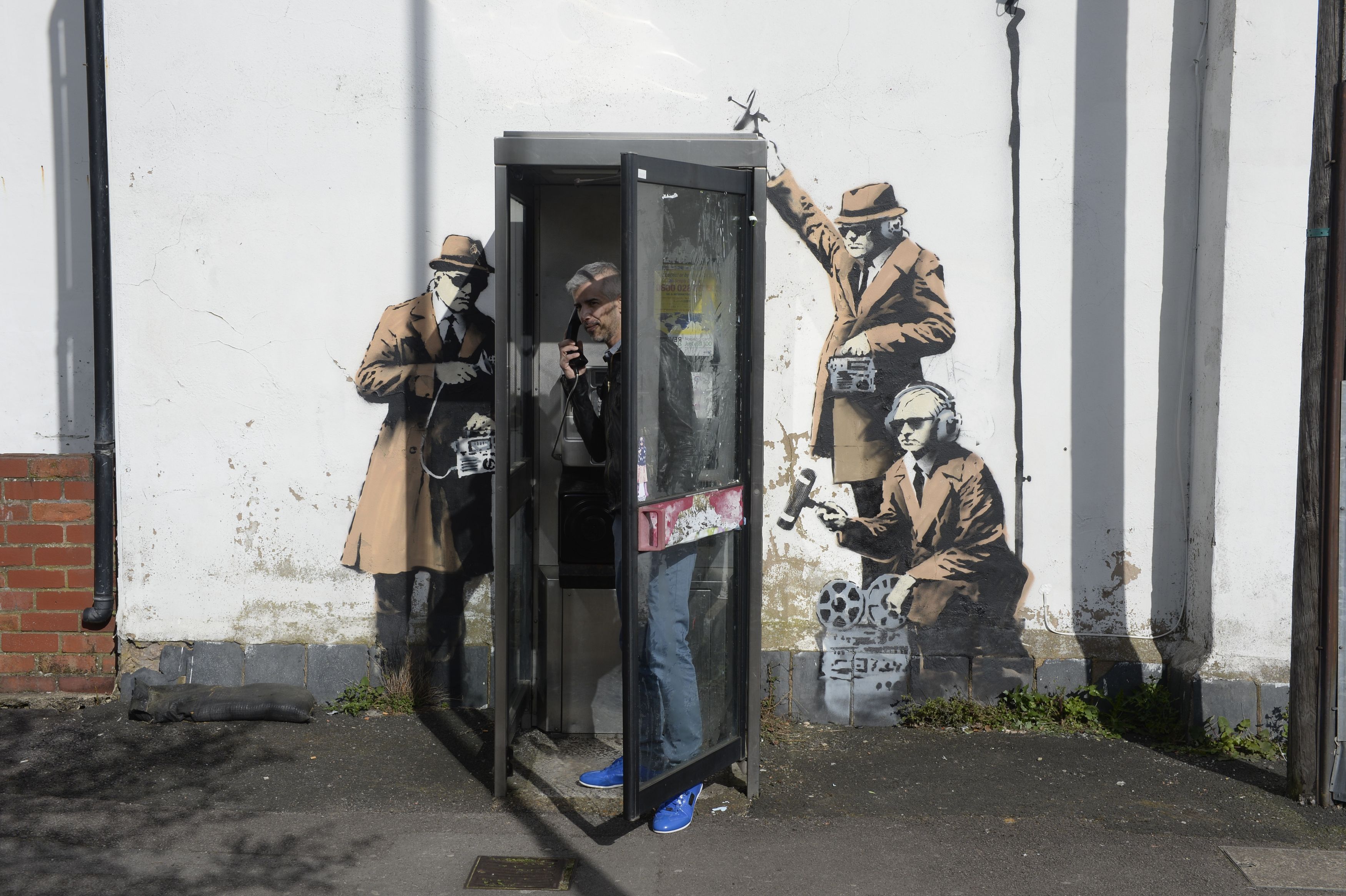 Fans think Banksy behind artwork mocking UK spies