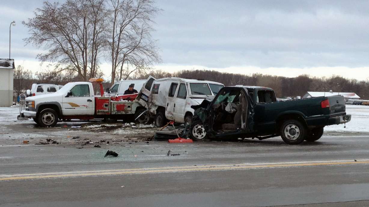 Armored van crashes on icy roadway, spilling cash