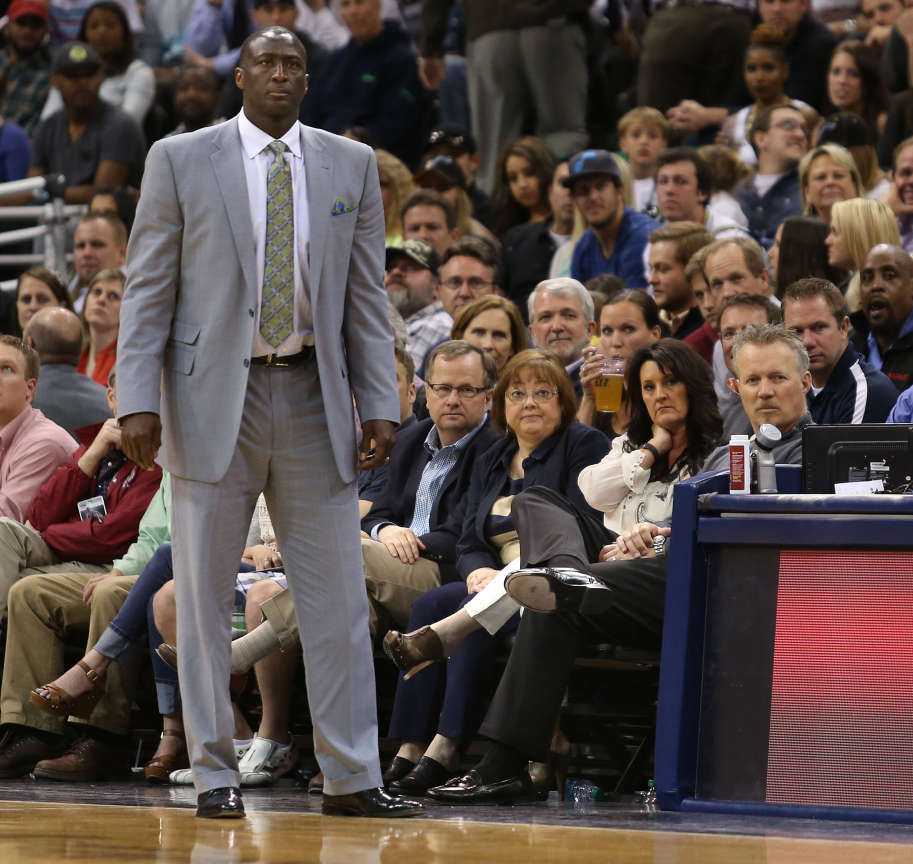 Utah Jazz coach Tyrone Corbin on the court with
Utah Jazz CEO Greg Miller watching on the far
right as the Utah Jazz lose to the Los Angeles
Lakers 119-104 in the last home NBA basketball
game of the season Monday, April 14, 2014, in
Salt Lake City.
