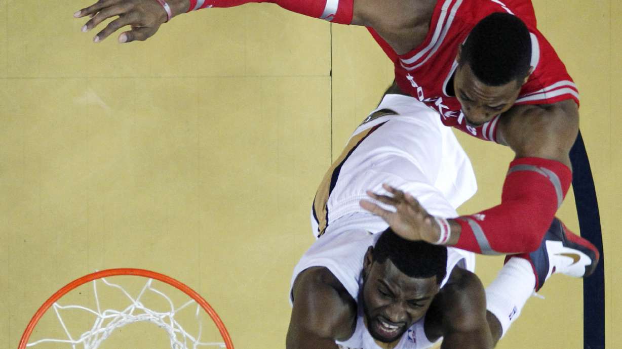 Evans leads Pelicans past Rockets, 105-100
