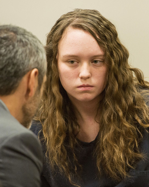 Defense attorney Rhome Zabriske talks with Meagan Grunwald, a teen charged in connection with a fatal officer shooting in Utah County, during a recess in her preliminary hearing in Judge Darold McDade's courtroom in Provo Thursday, April 17, 2014. (Photo: Rick Egan)