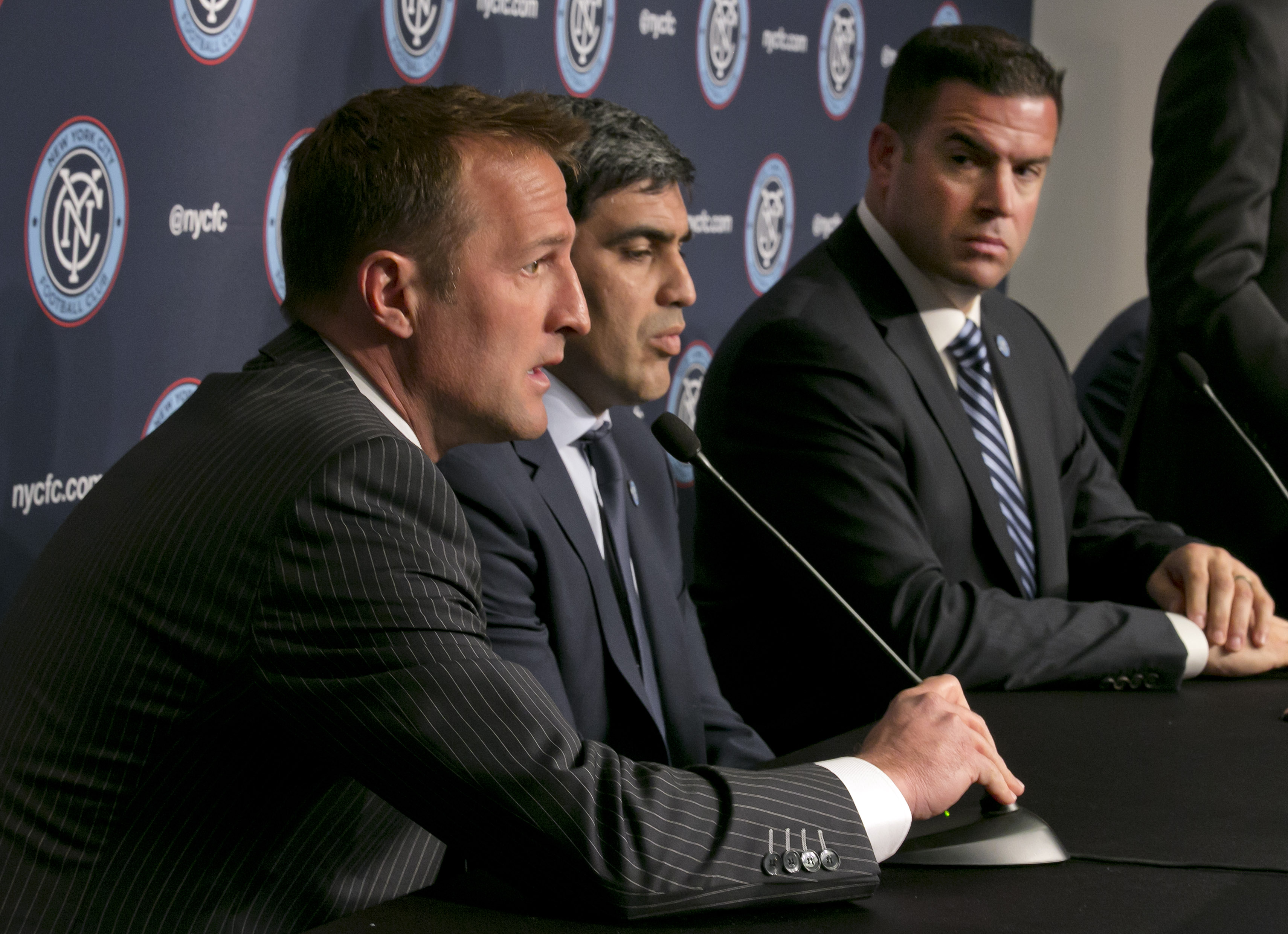 New York City FC head coach Jason Kreis, shown with director of football operations Claudio Reyna and chief business officer Tim Pernetti, will make his return to Rio Tinto Stadium on May 23 after exiting the club in 2013. (AP photo)