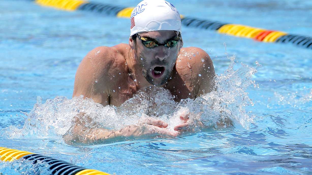 Michael Phelps launches comeback in 100 butterfly