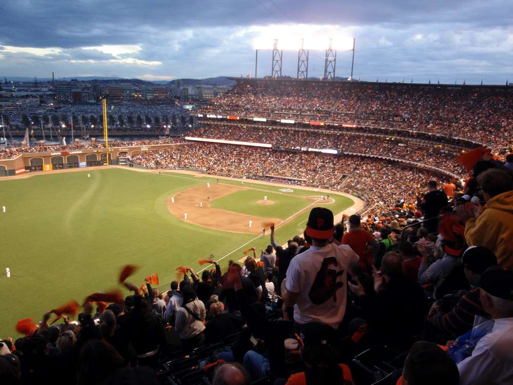Giants fans cheer waving rags in anticipation of upcoming pitch game
2 of the 2010 World Series game between Giants and Rangers Oct. 28,
2010 at AT&T Park San Francisco. Photo Credit: Shutterstock