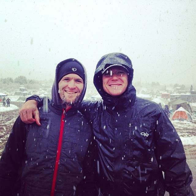 Craig Lloyd and Steve Frogley pose for a
picture during a storm that swept through
Southern Utah at the Trail Ragnar race.
