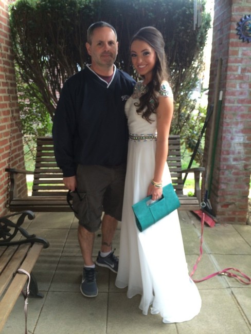 Senior Abby Rodgers, here with her father, went 
without a date to St. Basil Academy's prom in 
suburban Philadelphia.
