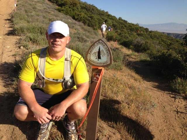 Jake Petersen poses for a picture on one of his favorite mountain
trails.