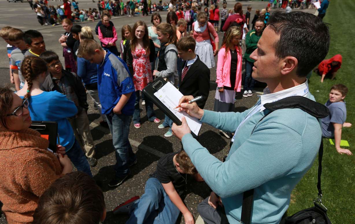 Rob Garrett does a roll call for his seventh-grade class from Maria
Montessori Academy during an evacuation drill in North Ogden on
Thursday, May 8, 2014.