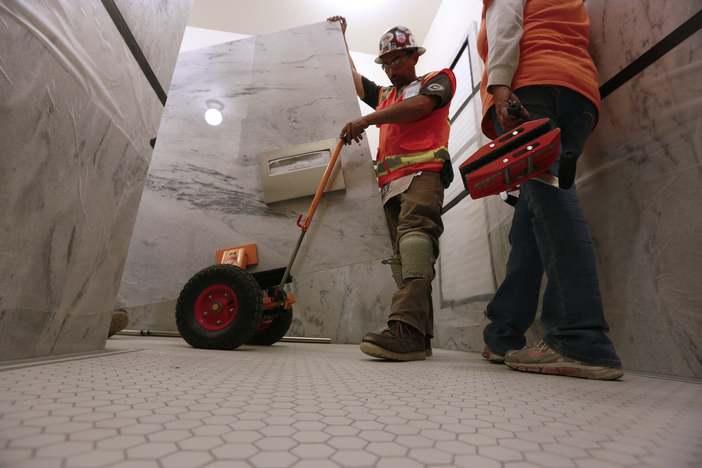 Construction workers replace the tile floors inside the state Capitol
Wednesday, May 7, 2014, in Salt Lake City.