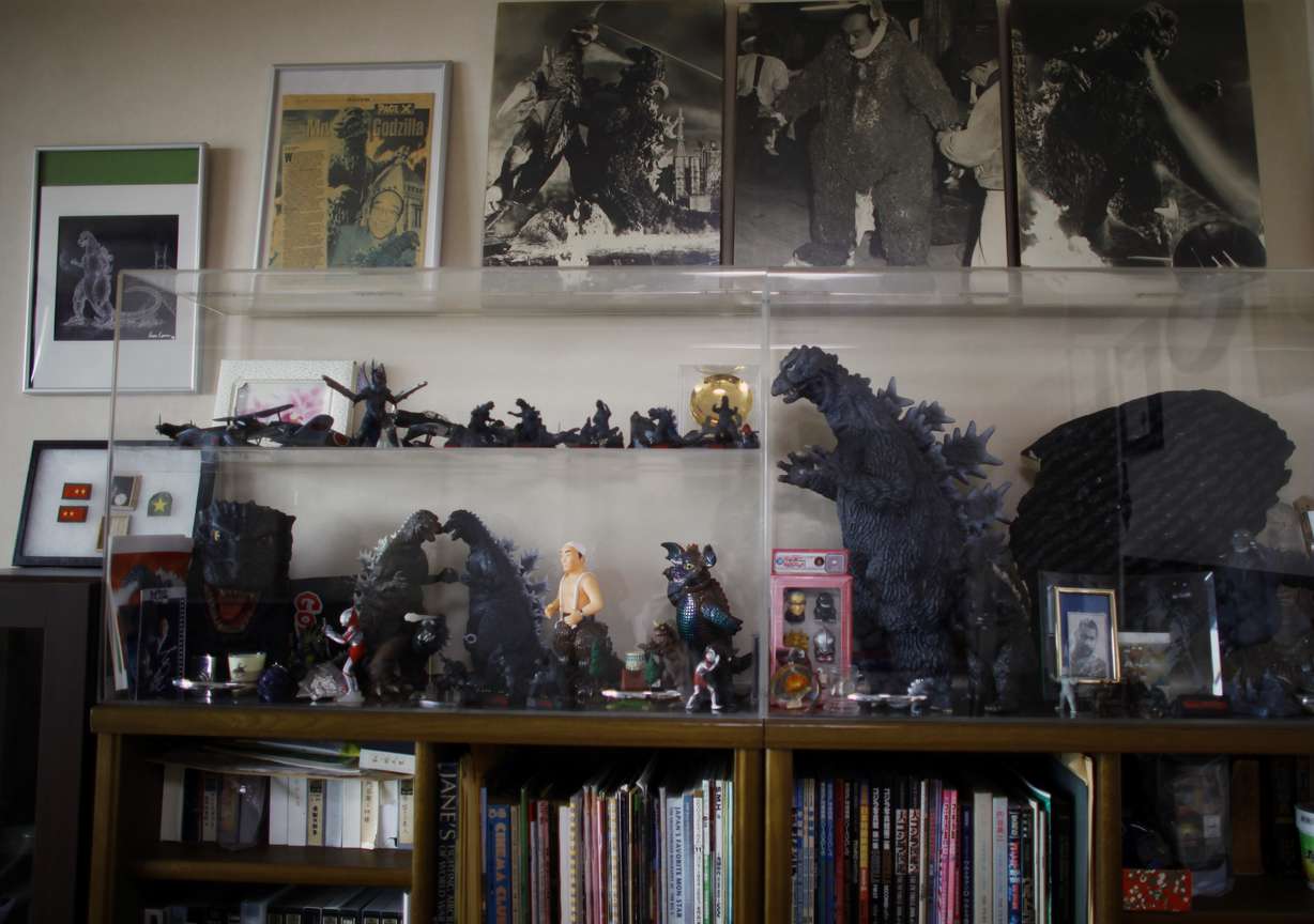 In this Monday, April 28, 2014 photo, collection of mementos about
Godzilla are displayed in a showcase as original suit actor Haruo
Nakajima, who has played his role as the monster, at his home in
Sagamihara, near Tokyo. It's not some cowboy movie, Nakajima, 85,
said proudly, sitting among sepia-toned photos of him as a young
man and Godzilla figures in his apartment. Everyone asks me to play
Godzilla again, he said. My Godzilla was the best.