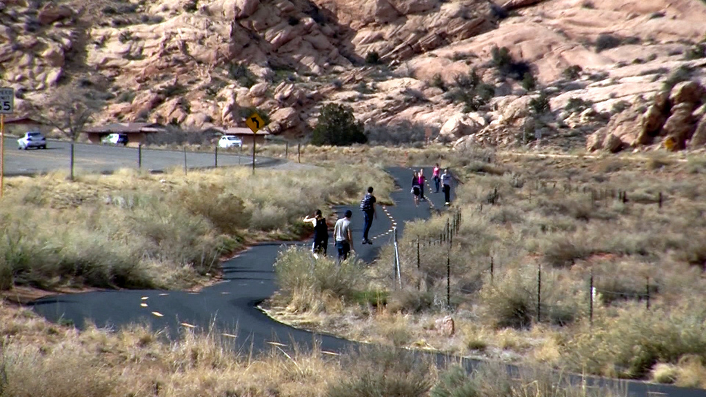 Walkers and skateboarders travel down a paved 
bike trail near Moab. It's part of a flurry of 
bike trail construction and planning in various 
parts of the state is beginning to connect Utah 
communities to the great outdoors. (Photo: KSL 
TV)