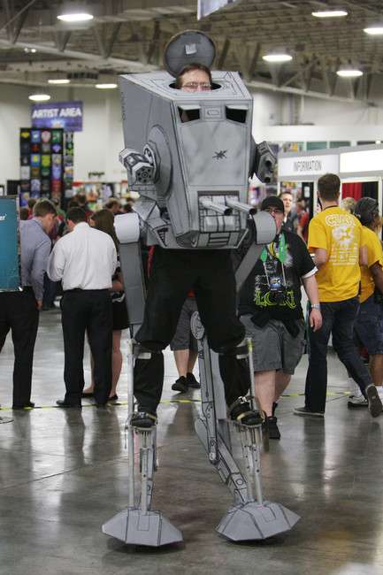 An attendee dressed as an Imperial Walker enjoys Comic Con at the Salt Palace in Salt Lake City Thursday, April 17, 2014.