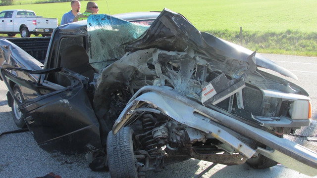 Witnesses rescue 2 men from overturned truck on Highway 91