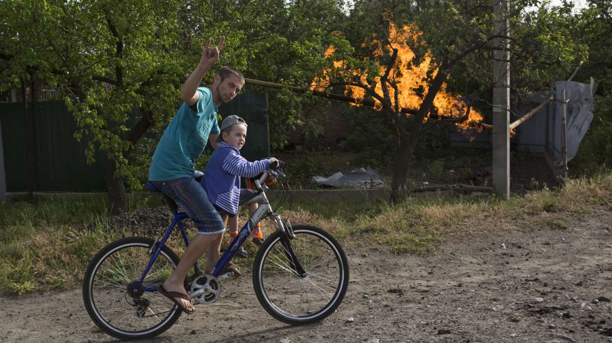 Putin orders troops near Ukraine to return home