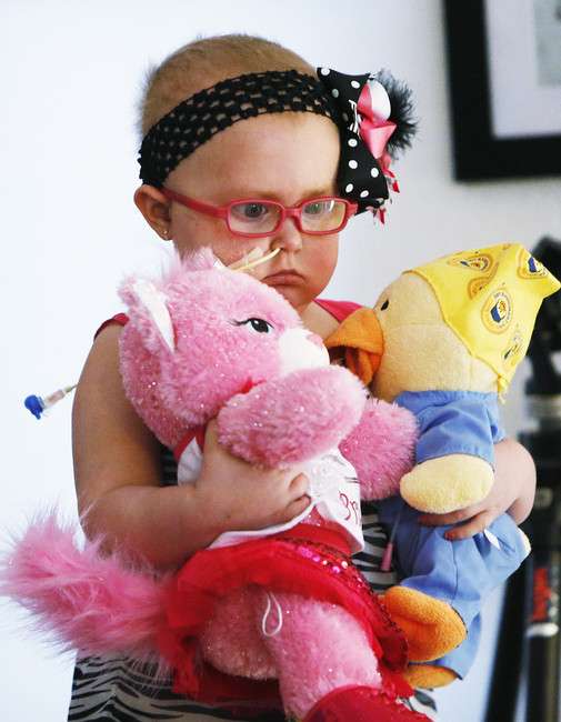 Brylee Olson plays with stuffed animals at her
home in Price April 23, 2014. Brylee was
diagnosed with an inoperable and terminal brain
tumor 14 months ago and has died two days short
of her fourth birthday . (Photo: Jeffrey D.
Allred, Deseret News)