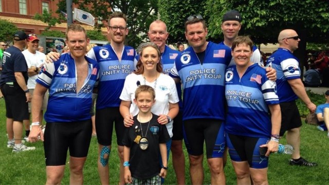 Shante Johnson, widow of Draper Police Sgt. Derek Johnson, and 
others at the National Law Enforcement memorial in Washington.