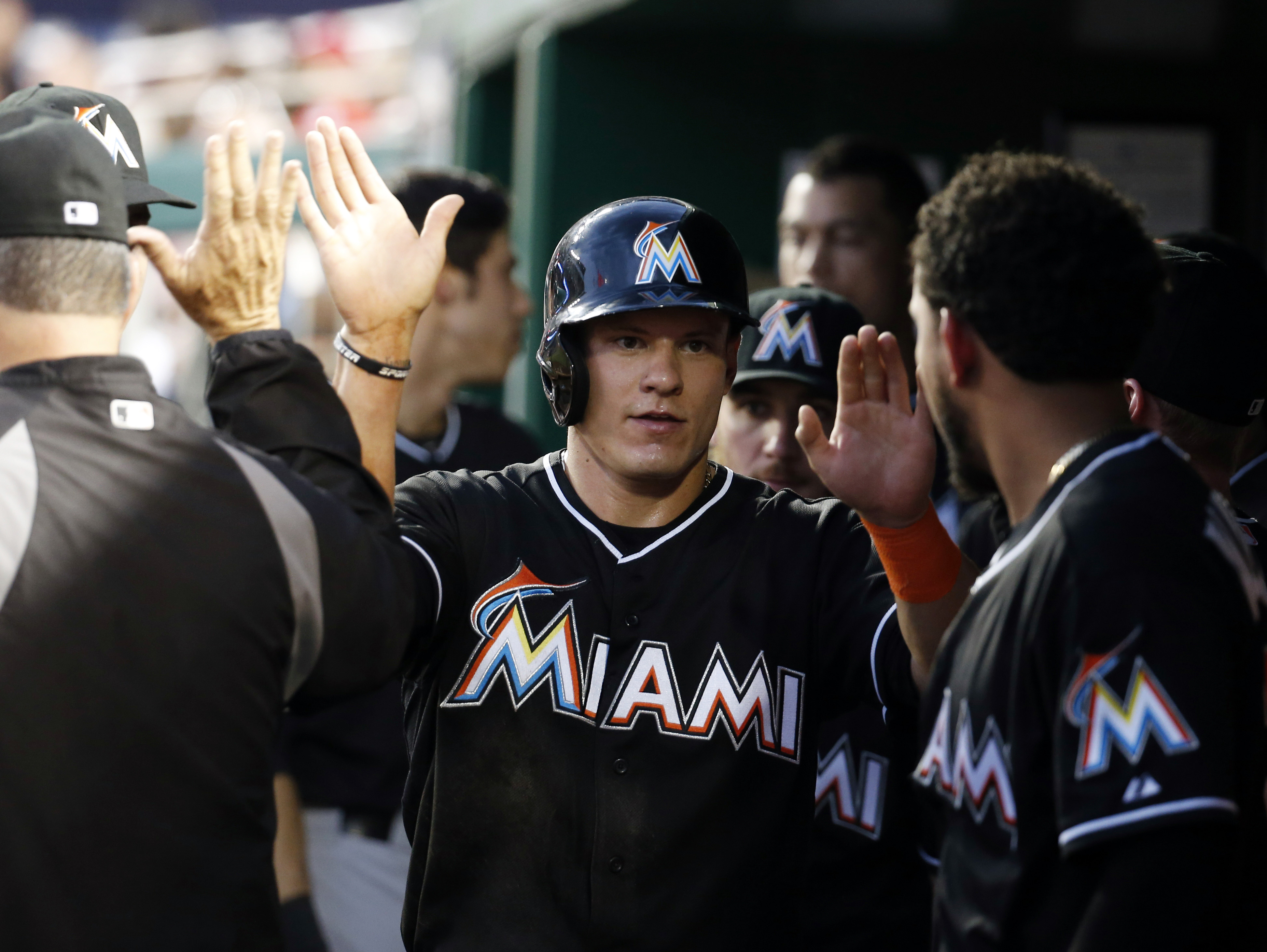 Four-run 10th lifts Marlins over Nationals 8-5
