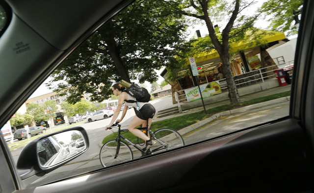 A biker pedals on 2100 South in Sugar House 
Thursday, May 29, 2014.