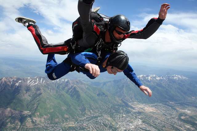 Richard Farr, 90, and tandem instructor Keegan Colton during their
free fall Saturday, May 31, 2014 as they jump with Dive Ogden.