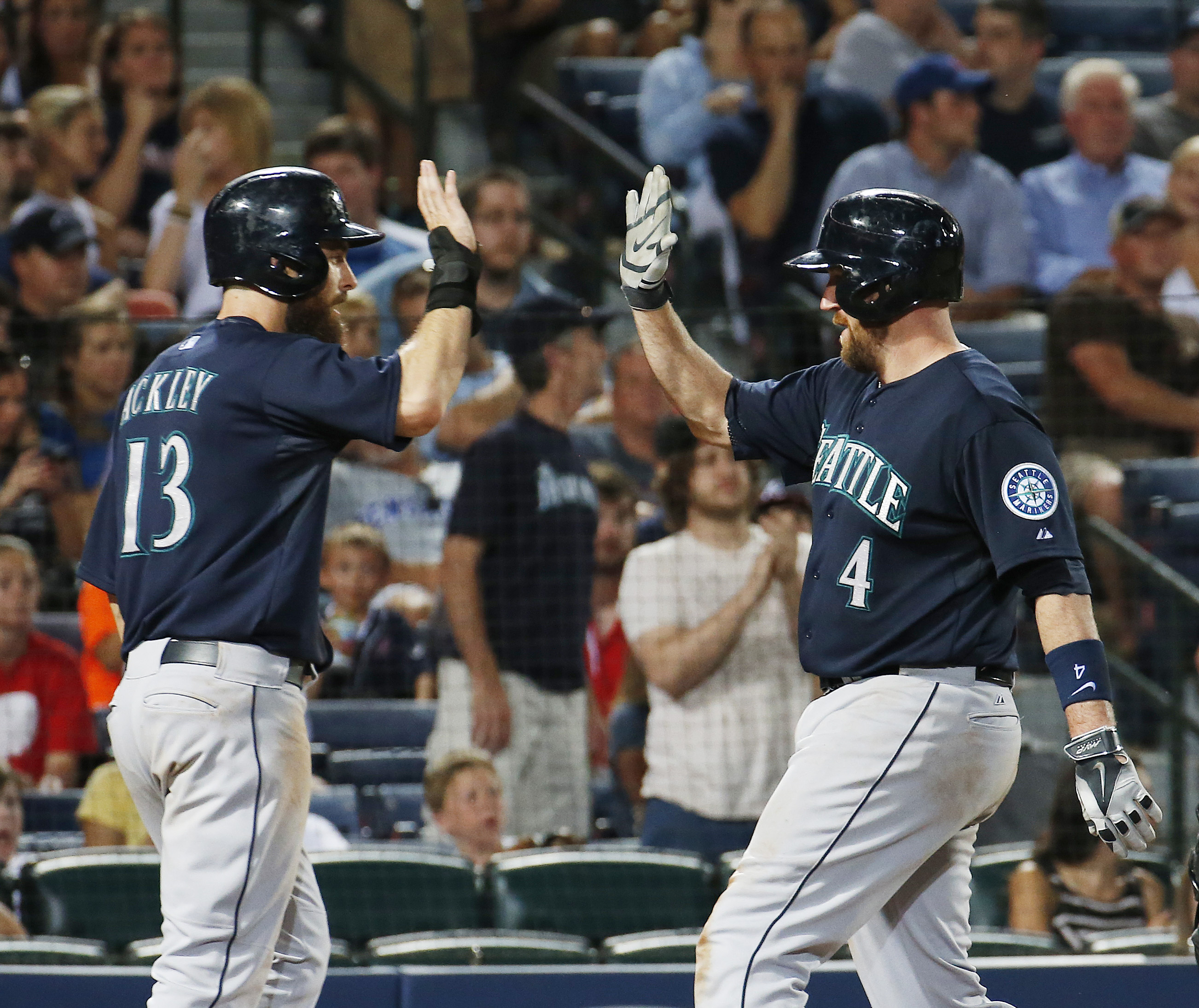 Buck's 2-run HR powers Seattle past Atlanta 7-5