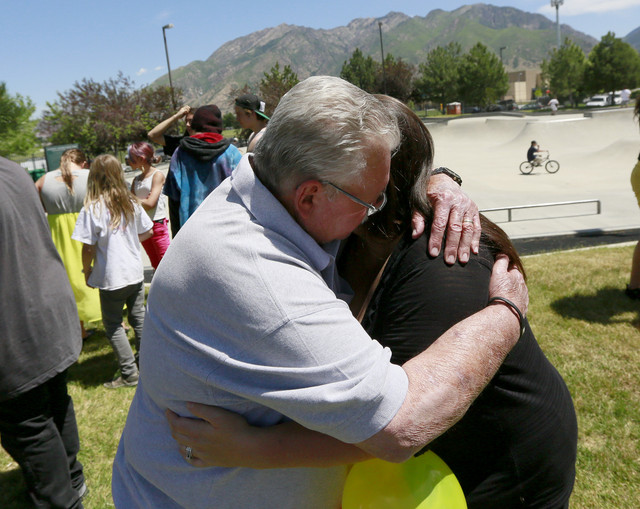 Harley Jarrett's grandfather Rodger Jarrett and his mother, Tara 
Schutz, hug during memorial for Harley at the Richard L. Guthrie Skate 
Park Friday, June 6, 2014, in Cottonwood Heights. Harley Jarrett, 17, 
was shot and killed at a graduation party on Wednesday night.