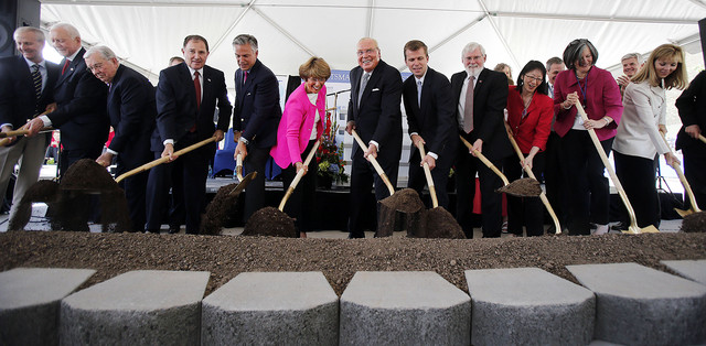 Dignitaries participate in a groundbreaking ceremony for the Primary 
Children's & Families' Cancer Research Center at Huntsman Cancer 
Institute in Salt Lake City, Friday, June 6, 2014. At center are Karen 
and Jon M. Huntsman.