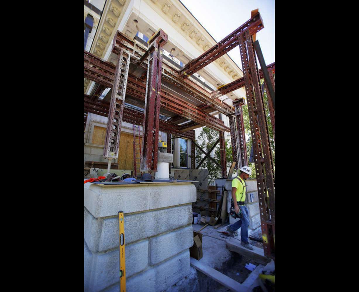 Crews repair a porch on the Governor's Mansion in Salt Lake City, Thursday, June 5, 2014. At right is Coltin Sharpe of W. W. Construction (Photo: Ravell Call, Deseret News)