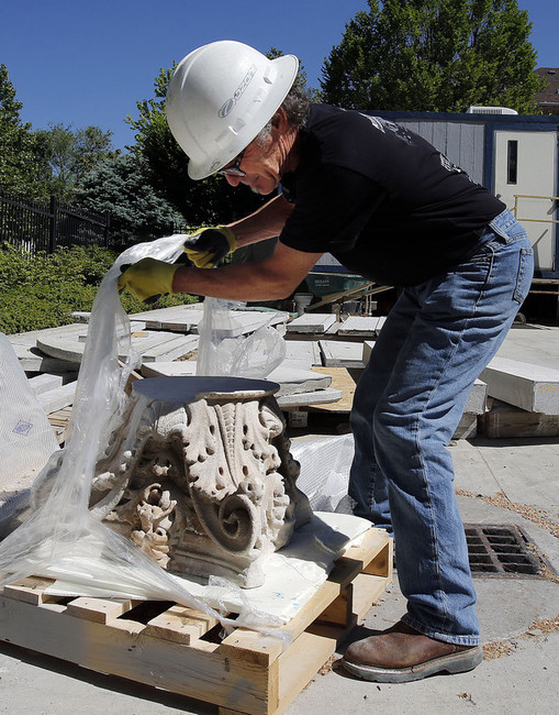 Superintendent Michael Hill of Paulsen Construction shows a column capital that was removed from a porch on the Governor's Mansion in Salt Lake City, Thursday, June 5, 2014. (Photo: Ravell Call, Deseret News)