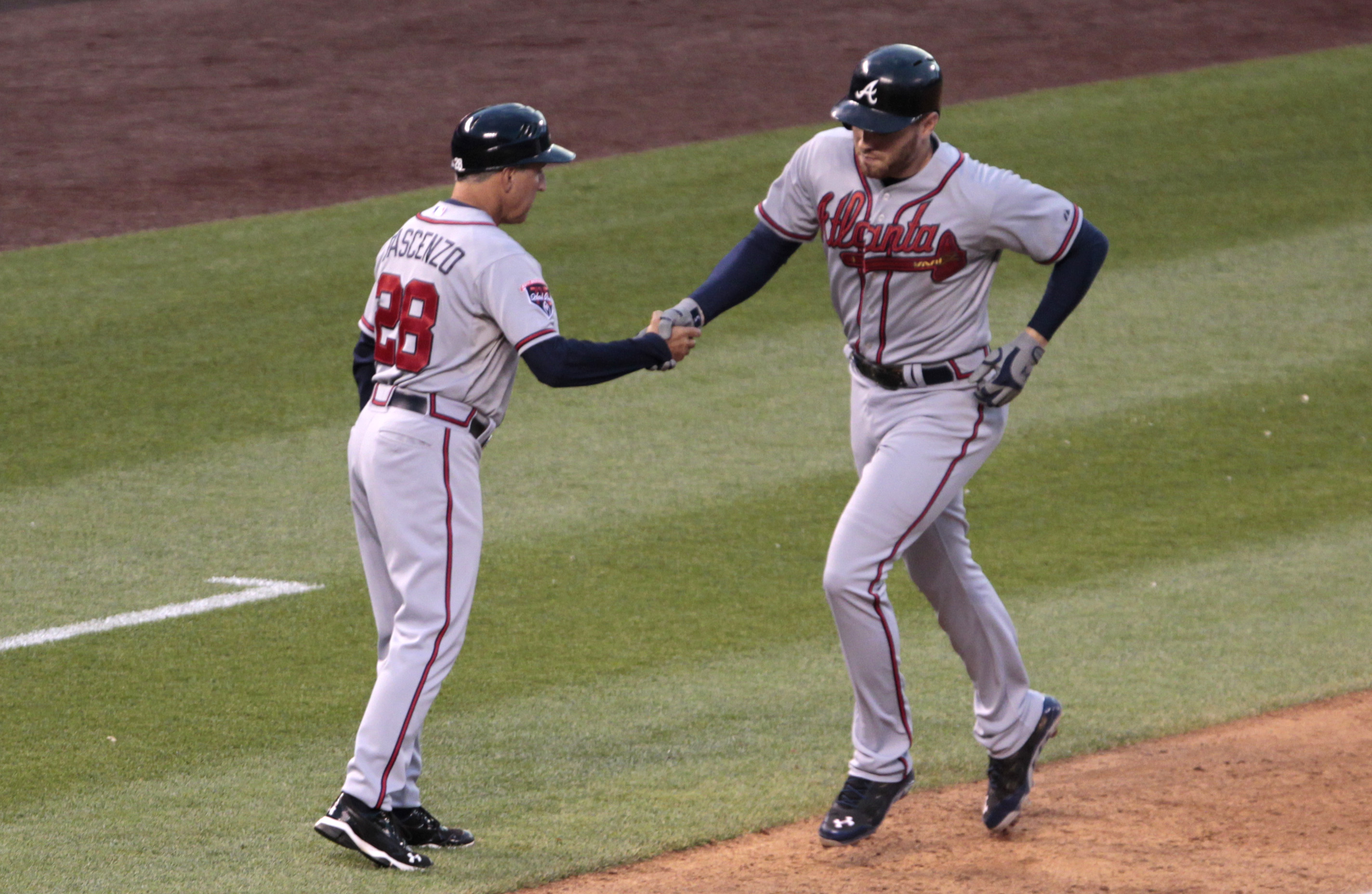 Braves ride 7-run first to 13-10 win over Rockies
