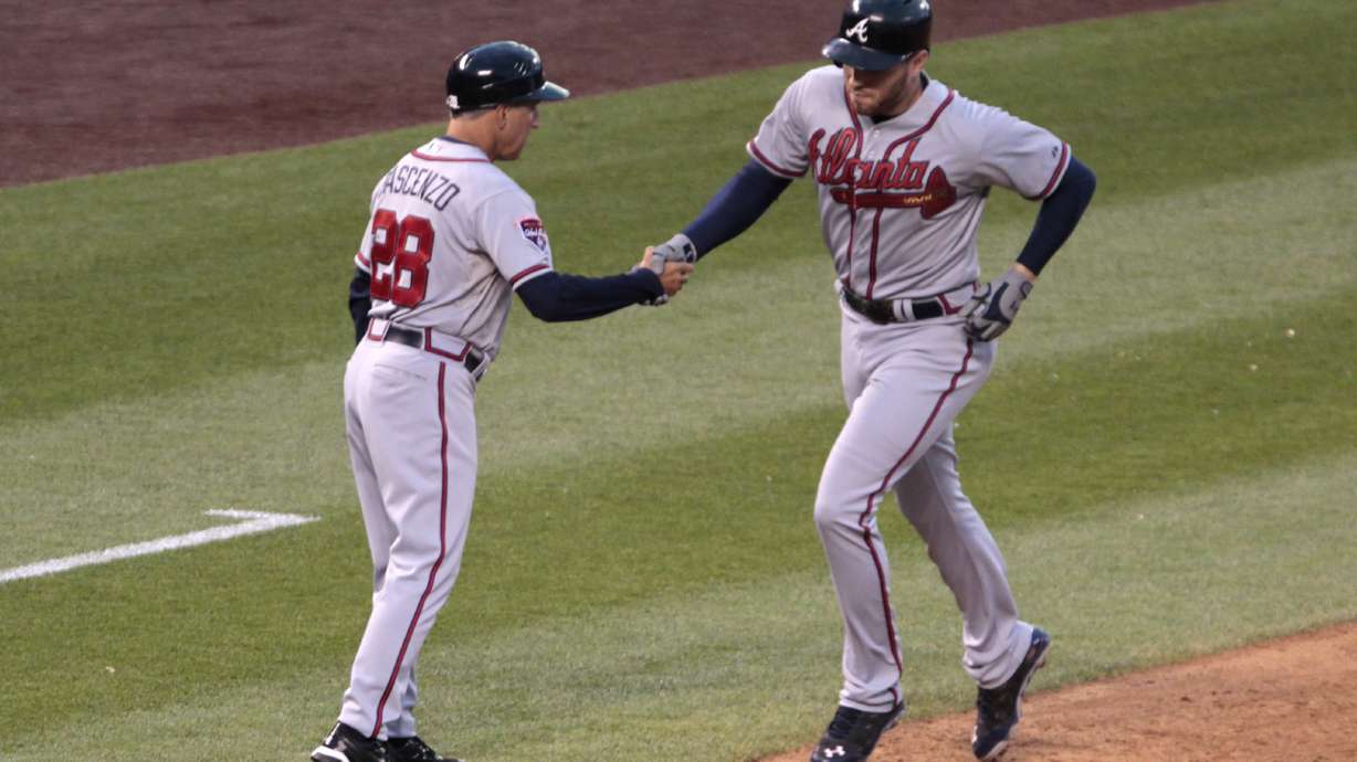 Braves ride 7-run first to 13-10 win over Rockies