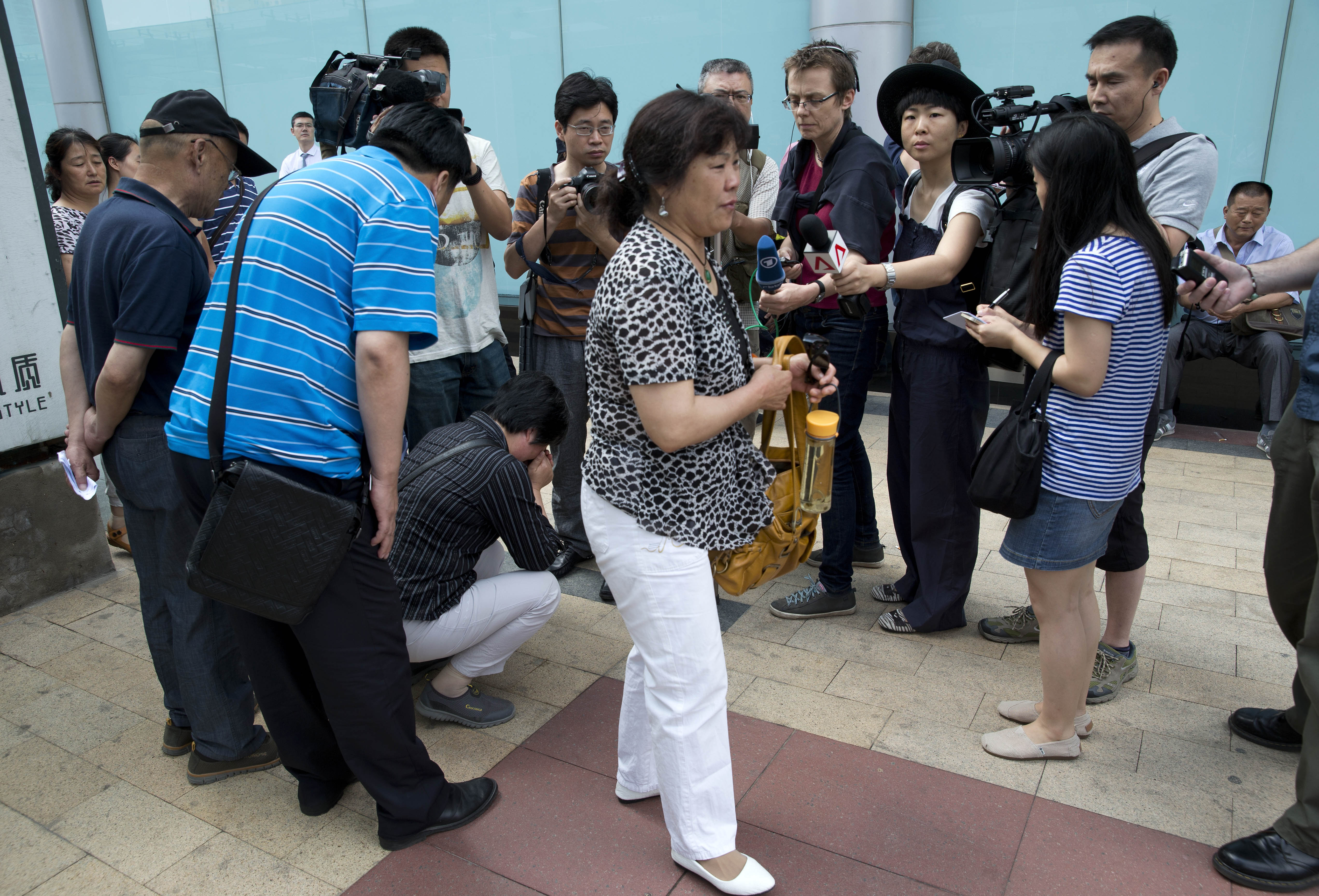 Families of Flight 370 passengers seek information