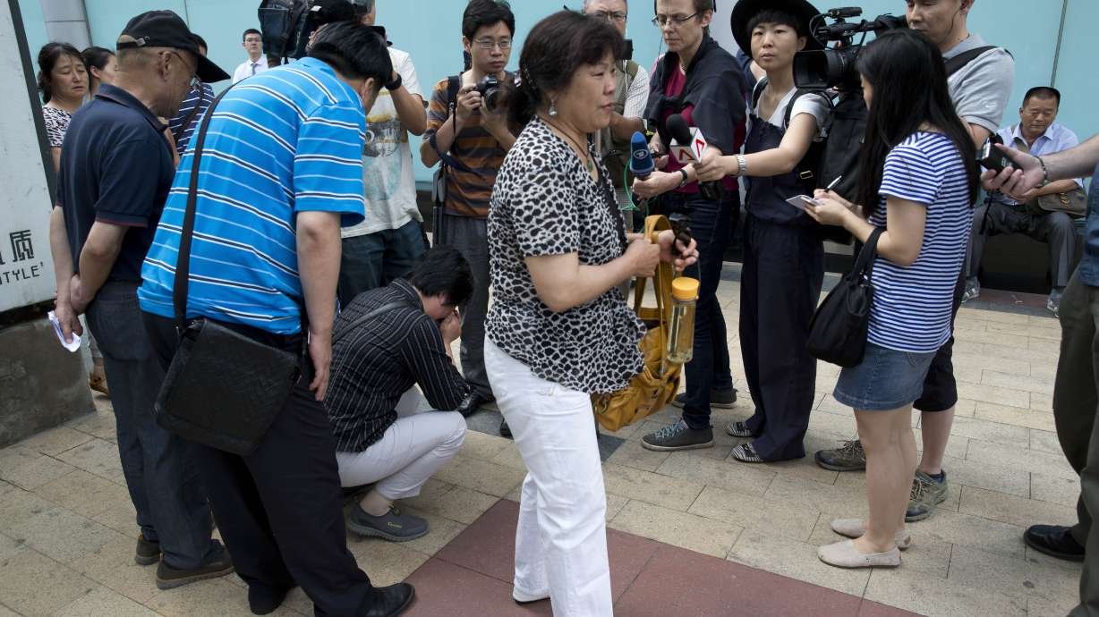 Families of Flight 370 passengers seek information