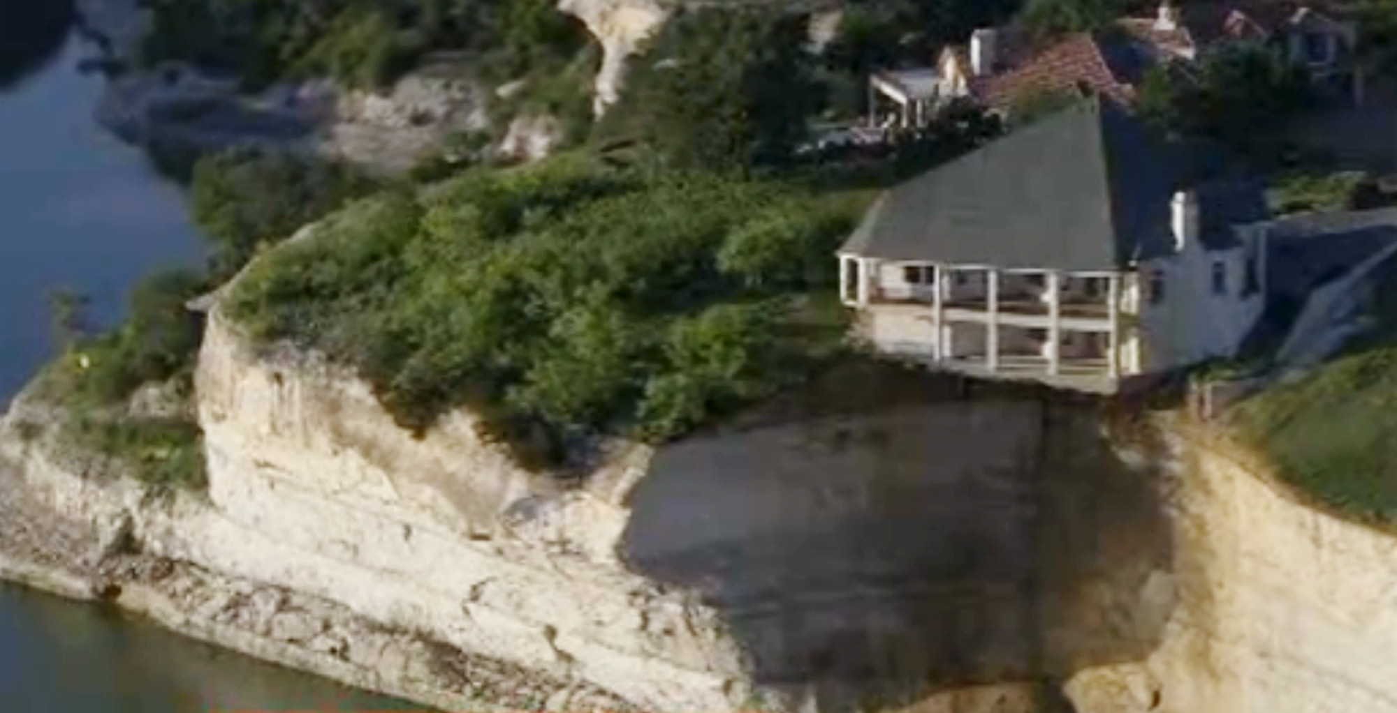 House teeters on edge of crumbling 75-foot cliff