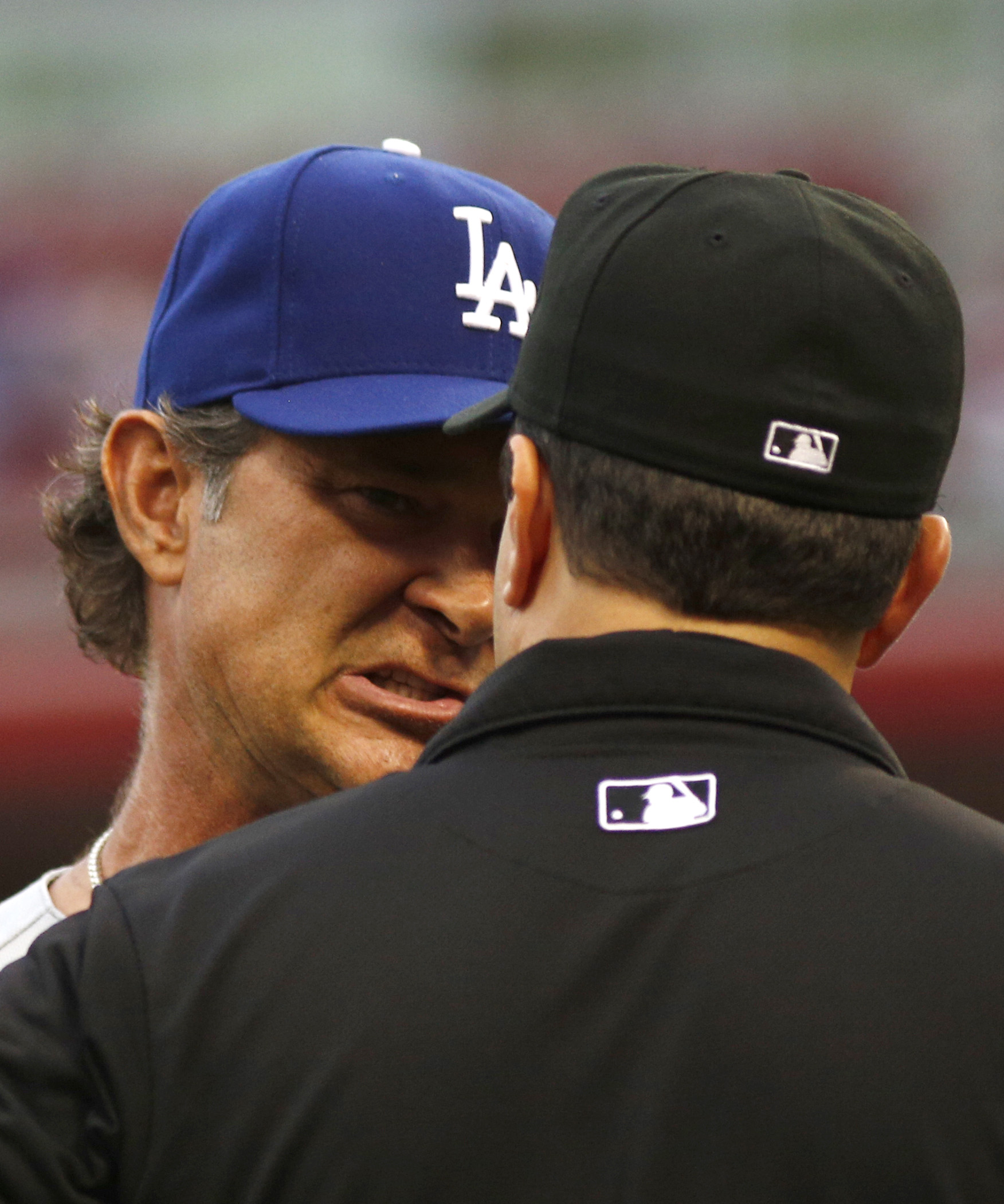 Kemp ejected, Dodgers fall to Reds 5-0