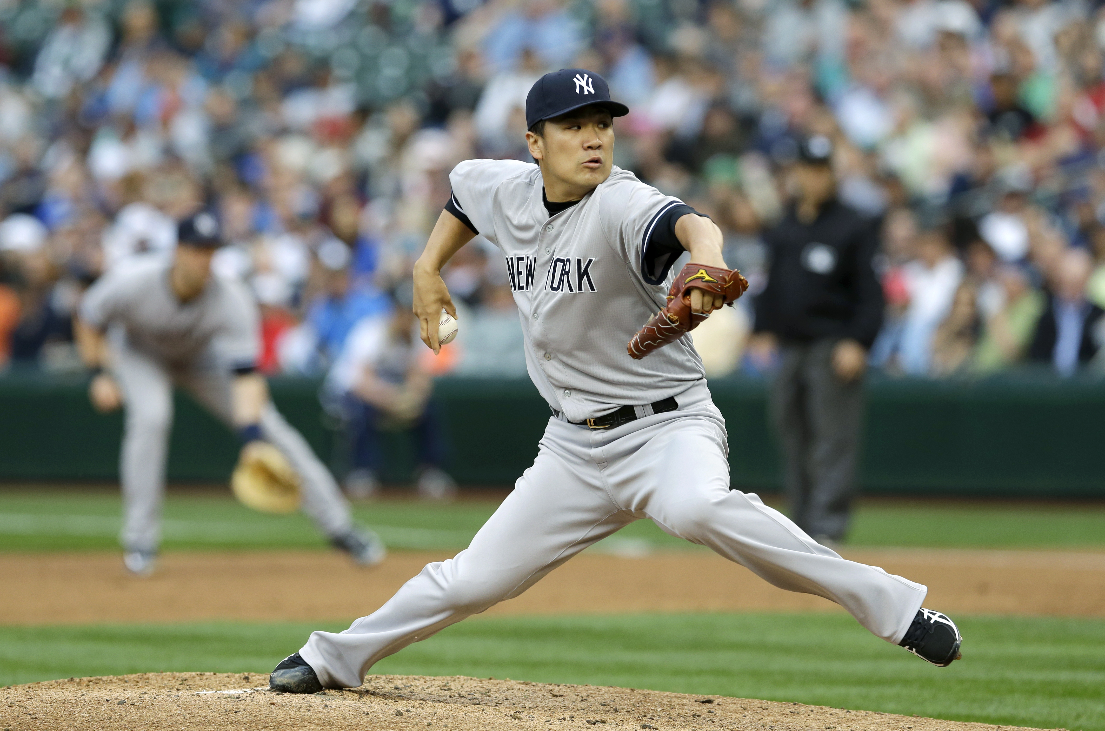 Tanaka strikes out 11, wins 10th as Yanks top M's
