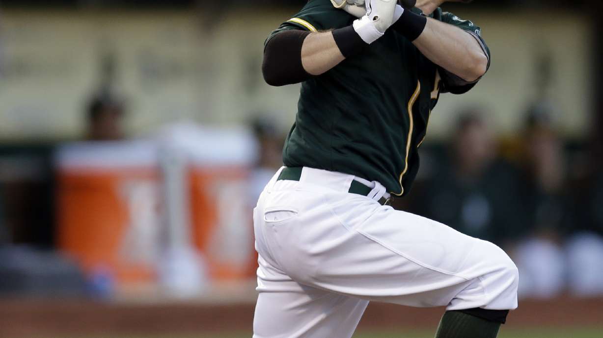 A's beat Yankees 5-1 after light outage delay