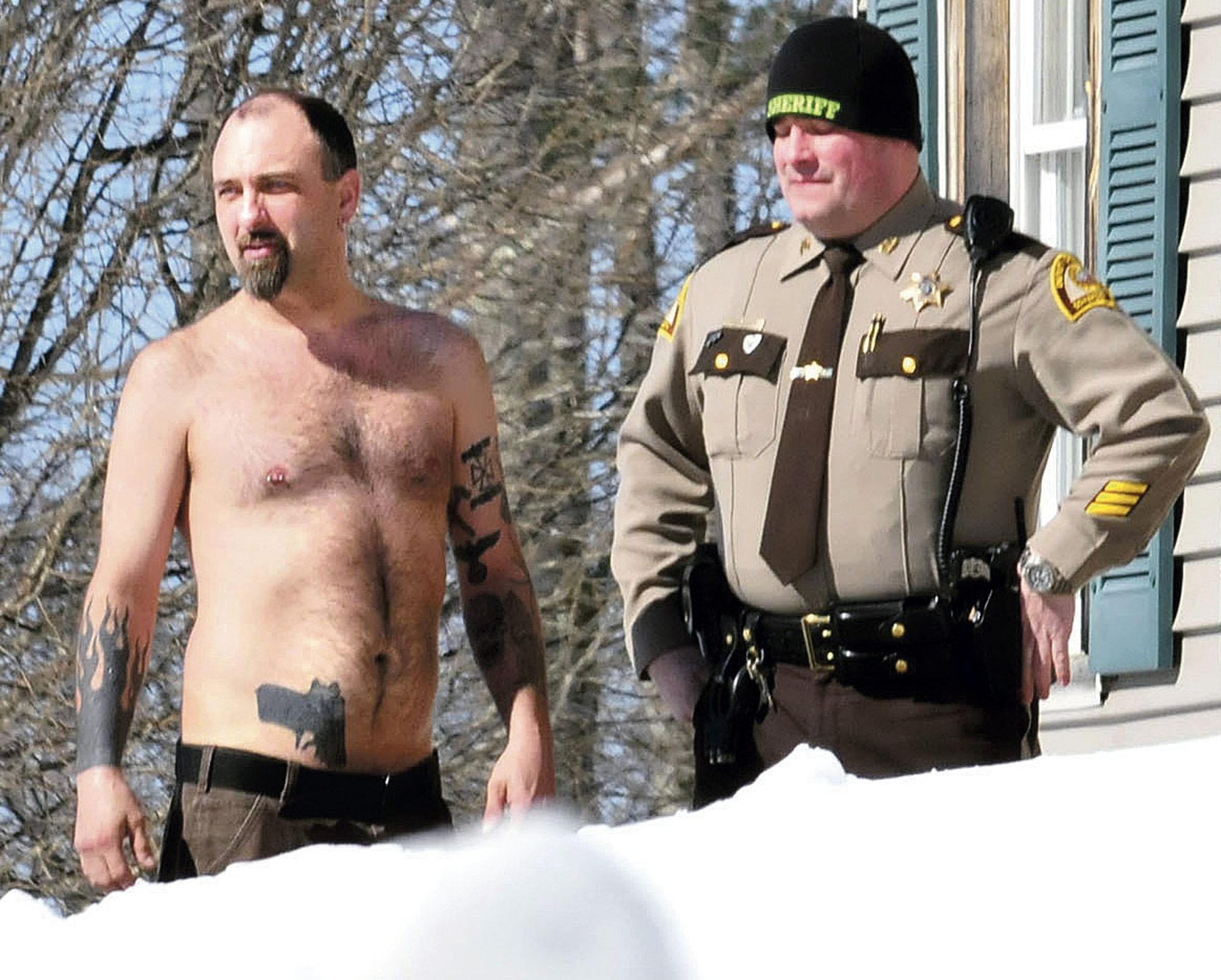 Cop: Man with gun tattoo had real gun in waistband